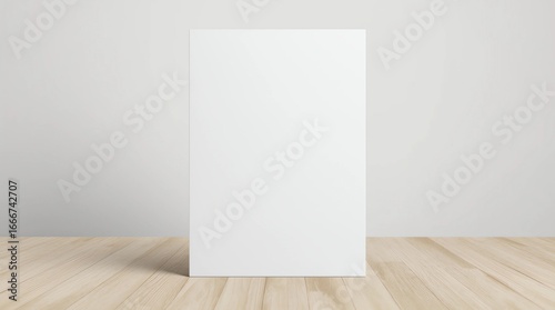 Wallpaper Mural vertical white flyer or sheet of thick paper standing upright on a light wooden floor Torontodigital.ca