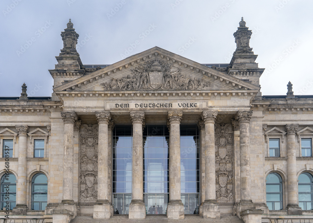 Fototapeta premium The Reichstag is a historic government building on Platz der Republik in Berlin, serving as the seat of the German Bundestag and the meeting place of the Federal Convention