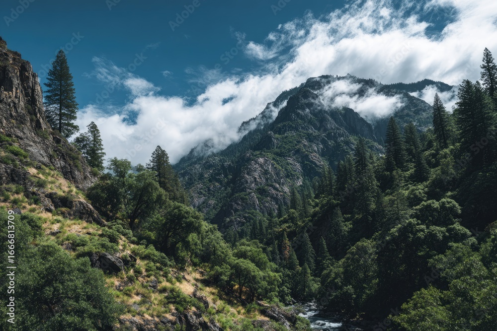 Obraz premium Mountainous valley scene with lush greenery and clouds