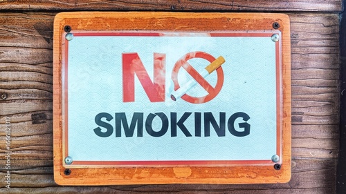 no smoking sign on a wooden wall