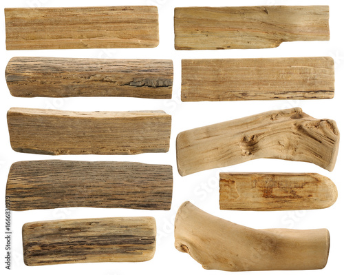A set of many various water smoothed wooden pieces on white background