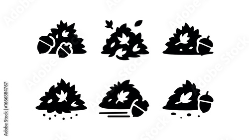 vector solid black filled icons autumn leaves pile (acorn scatter): acorn caps leaf bits shadow smear light rim ground speck motion lines.