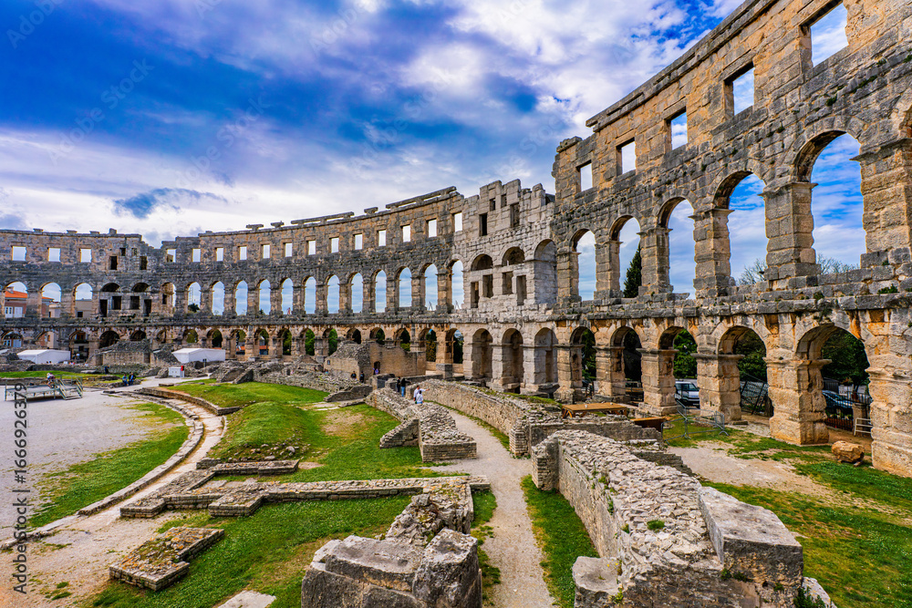 Fototapeta premium Pula, Croatia, 18 April 2025 - Inside of the Pula Arena, the old roman theater in the old town of Pula