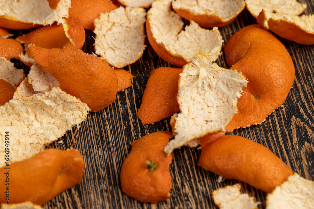 Fototapeta premium peel of peeled oranges on the table, a large amount of peel of peeled citrus fruits on the table