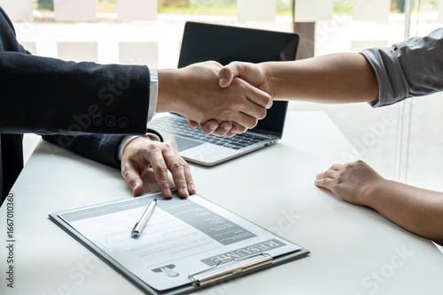 Good deal of interview, Business people and recruiter shaking hands greeting or get acquainted of conducting a job interview while sitting at the working meeting in office