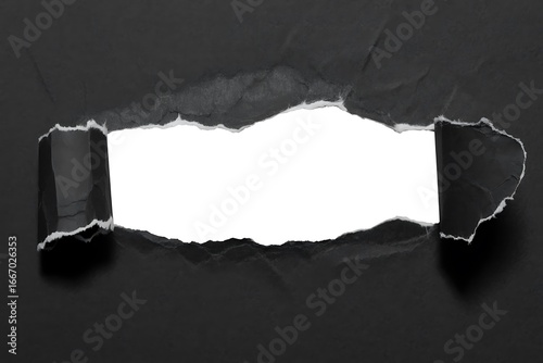 Torn black paper revealing white space with rough edges