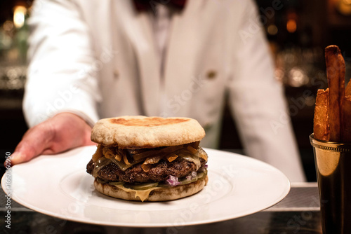 Wallpaper Mural Bartender serving a hamburger on a plate Torontodigital.ca