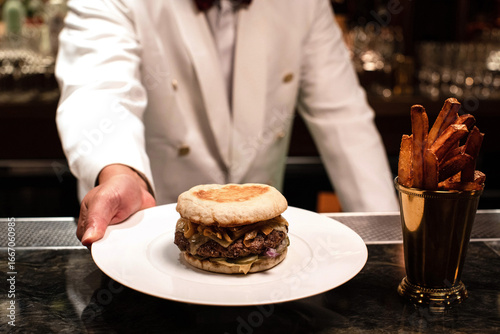 Wallpaper Mural Bartender serving a hamburger on a plate Torontodigital.ca