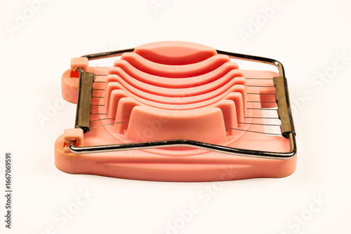 Vintage Pink Egg Slicer on White Background