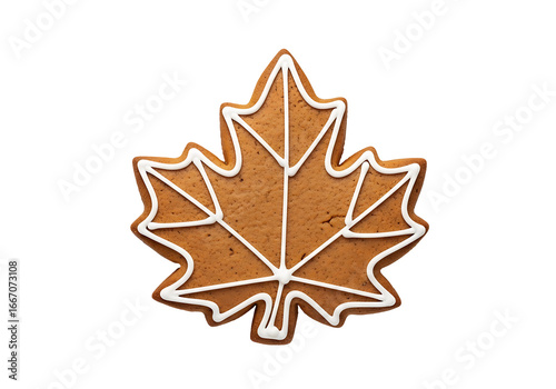 A decorative gingerbread cookie in the shape of a maple leaf, outlined with white icing, is featured against a black backdrop.