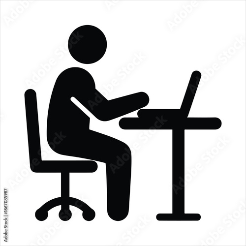 Person sitting at a desk working on a laptop computer an office workspace symbol