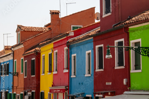 Fotografie colorful houses in burano island venice italy, warm colors, sunny day,