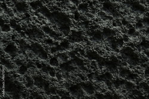 Close up textured abstract background of dark rough organic material