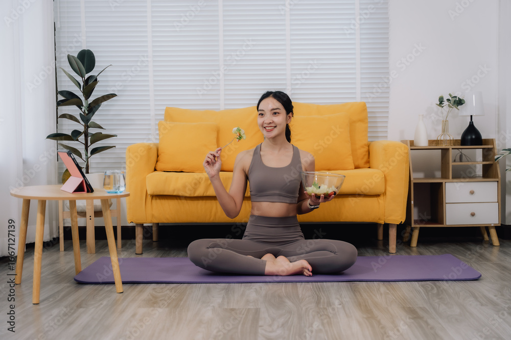 Obraz premium Healthy Woman Eating Salad After Yoga