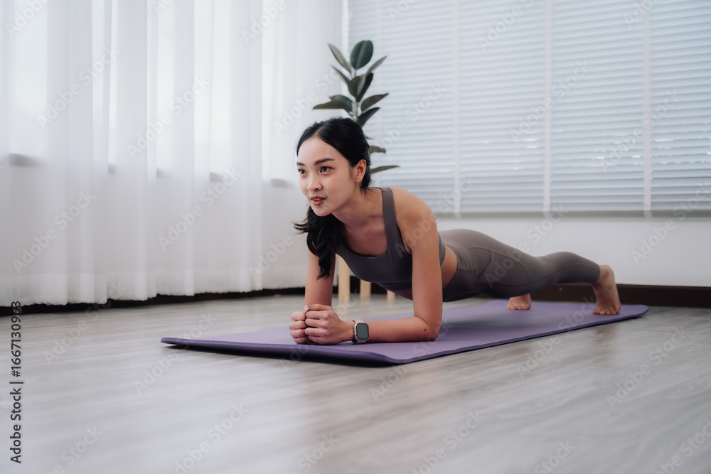 Woman Doing Plank Exercise at Home Woman Doing Plank Exercise at Home