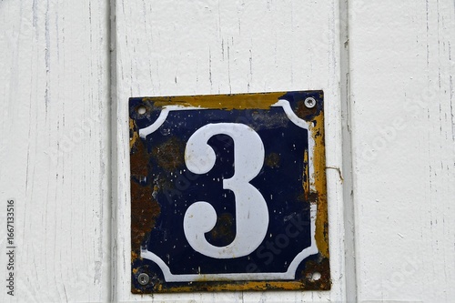 Old number 3 sign on house in Denmark. 