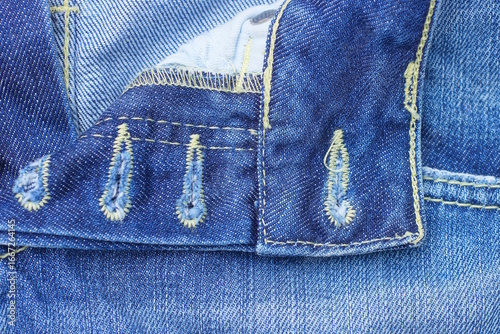 Photos texture of buttonhole on blue cotton denim pants