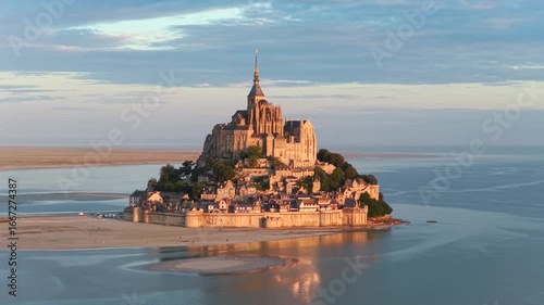 Cinematic aerial view of the Mont Saint Michel in Normandy France at sunrise