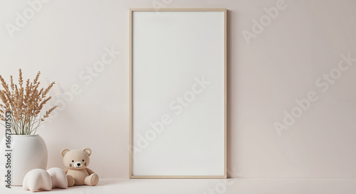 Minimalist interior with empty frame, teddy bear, and floral vase  