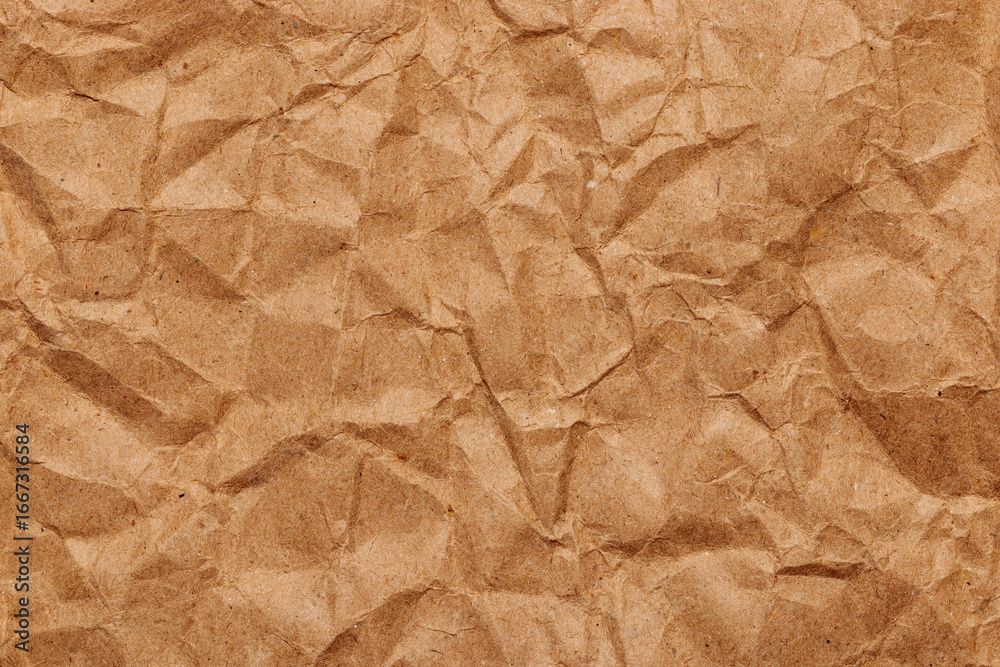 Fototapeta premium Brown crumpled recycled paper texture, blank template wrinkly background with space for text