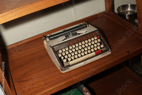 Vintage Typewriter on Wooden Shelf