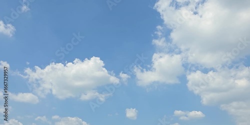 Cloudscape, Timelapse of a beautiful Blue sky with scattered white clouds in daylight, for a background	

