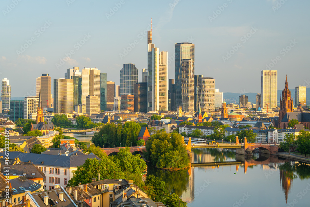 Naklejka premium Frankfurt City Skyline, Residential Buildings, Bridges and Main River on Sunny Morning. Aerial View. Golden Hour. Hesse, Germany