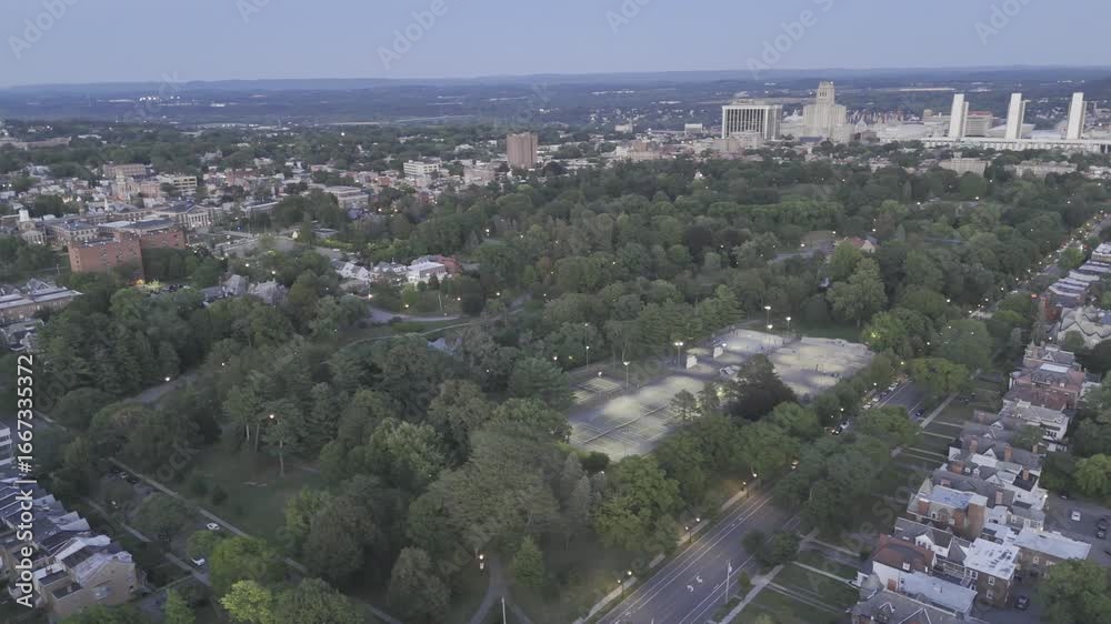 Drone orbits to the left around the west side of Washington Park at twilight after sunset in Albany, New York, USA Drone orbits to the left around the west side of Washington Park at twilight after sunset in Albany, New York, USA
