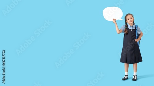 Happy schoolgirl holding bl...