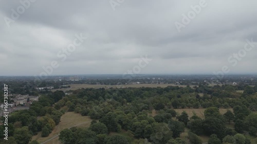 Aerial view over cloudy and green countryside