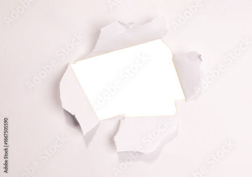 A realistic torn hole in paper with rough edges, isolated on transparent background (PNG). Perfect for design mockups, photo overlays, or creative cutout effects revealing content beneath.