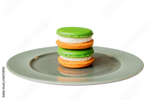 Macaron Tower: A stack of three colorful macarons, presented on a pristine plate, showcasing the artistry of fine pastry and culinary delight.