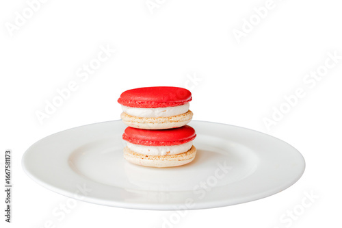 Delicious Macarons Delight: Two vibrantly colored macarons rest artfully on a pristine white plate, a testament to the beauty of culinary artistry.