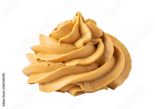 Close-up of a swirled caramel-colored whipped topping against a black background.