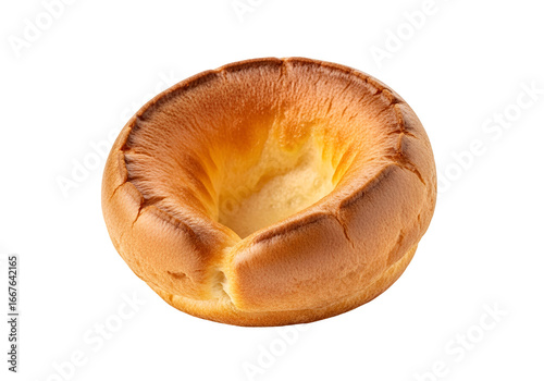 A golden-brown, perfectly cooked, individual bread roll boasts a hollow center and crispy edges against a black backdrop.