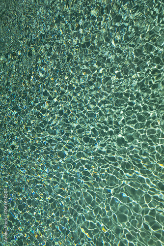 play of sun rays on water surface, texture, background