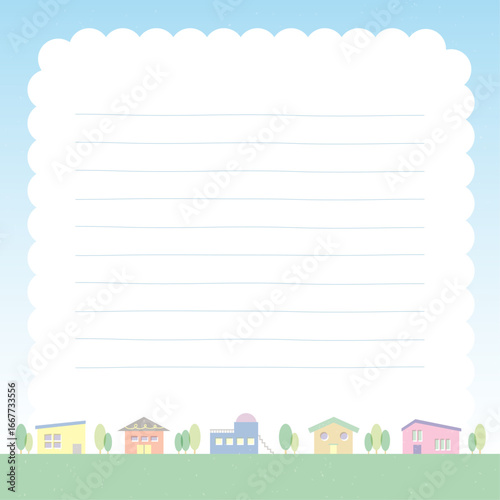 青空と雲を背景にした優しい色の街並みのノートパッド