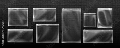 Transparent zip lock bag set with various sizes and white sealing strips for organizing items on dark background. Clear rectangular plastic pouches for storage or packaging with resealable closures.
