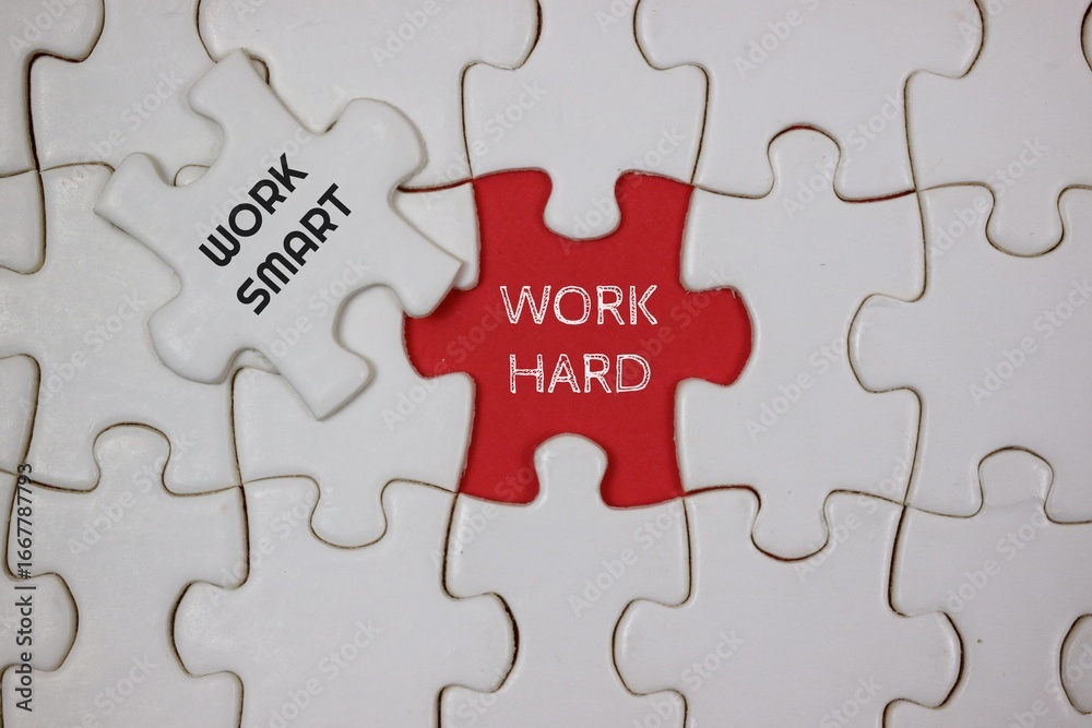 Fototapeta premium Conceptual Puzzle Representing Hard Work and Smart Work Techniques, highlighted in red and white puzzle