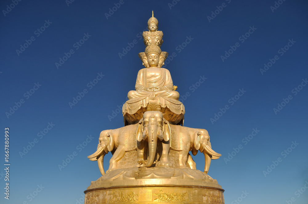Fototapeta premium The statue of Ten Directions Samantabhadra Bodhisattva on the Golden Summit of Mount Emei in Sichuan Province, China. It is currently the largest and tallest statue of Ten Directions Samantabhadra Bod