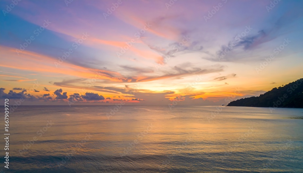Fototapeta premium Vibrant Sunset Over the Calm Ocean Waters with Colorful Sky.