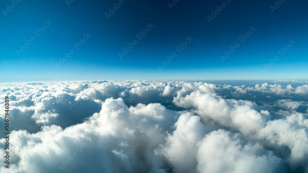 Fototapeta premium View of fluffy clouds overhead aerial perspective nature photography clear blue sky serene atmosphere tranquil scene