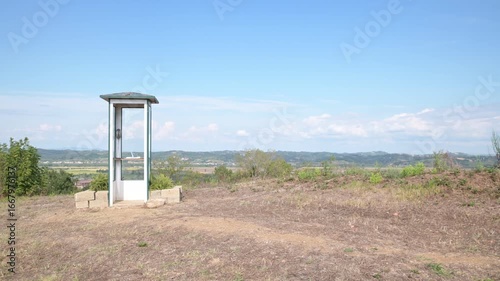 An isolated telephone booth in the countryside of Santo Pietro Belvedere, Capannoli, Italy