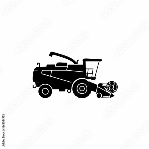 Silhouette of a modern combine harvester with cutting head and grain elevator