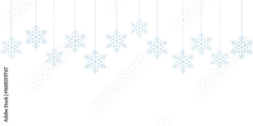 Hanging blue snowflakes on white winter