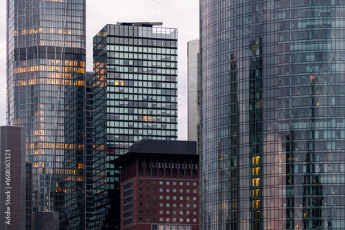 Tall office buildings in Frankfurt, Germany, financial district, symbolizing modern corporate architecture with reflective facades, vertical design and contemporary urban development