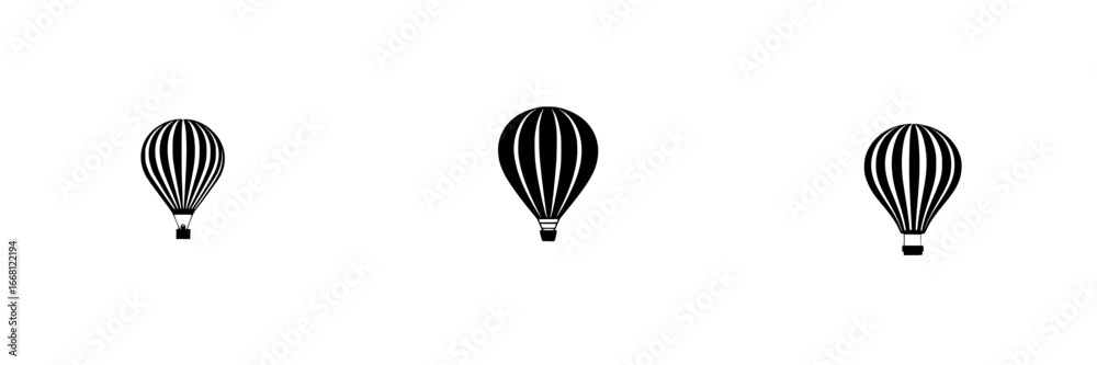 Fototapeta premium Hot air balloons in a clear sky drifting gently during sunrise over an open field