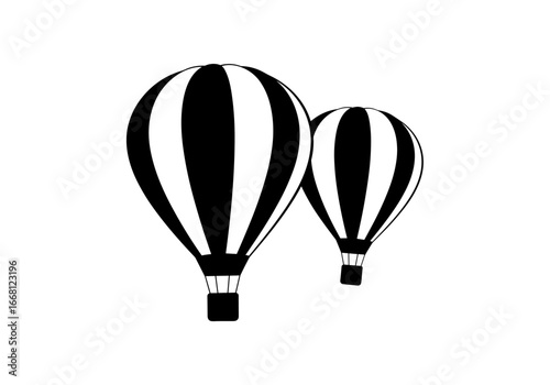 Two stripped hot air balloons ascending into the sky on a clear day for aerial exploration and adventure
