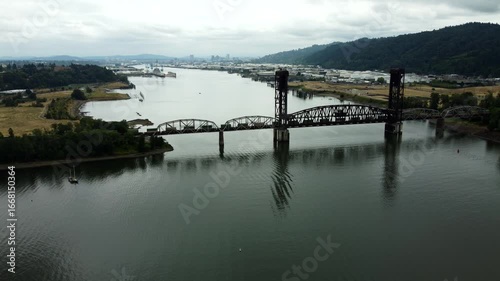 Wallpaper Mural US, Oregon, Portland, St Johns, 2025-07-26 - Drone view of a freight train going across the Train Bridge Torontodigital.ca