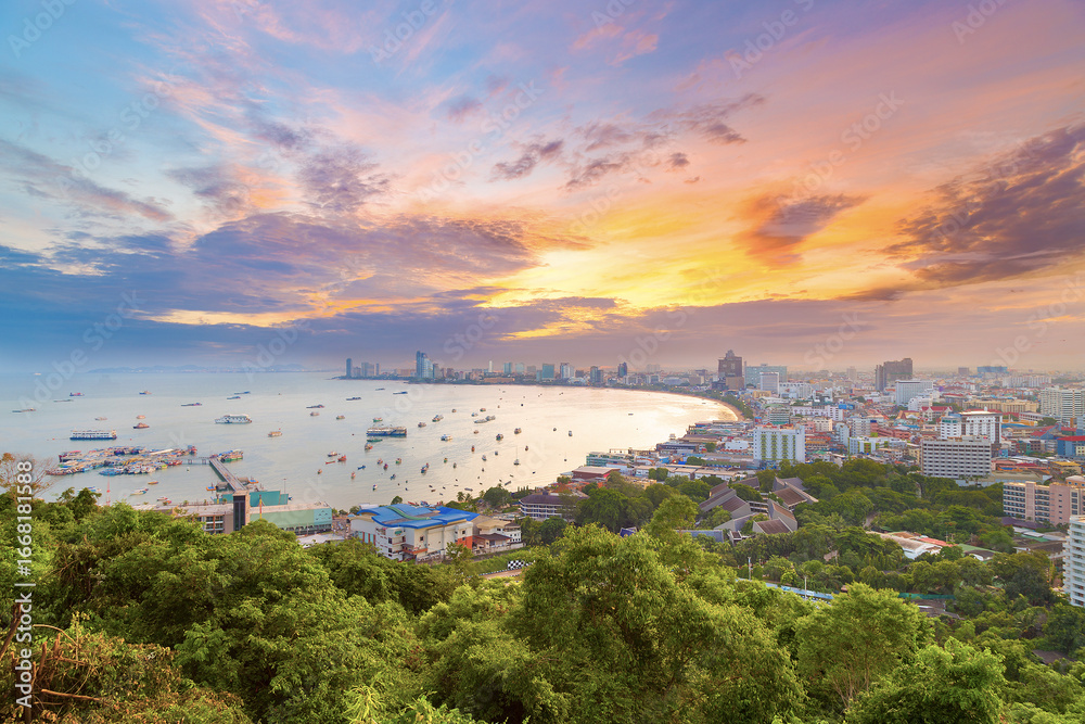 Fototapeta premium The building and skyscrapers in twilight time in Pattaya,Thailand. Pattaya city is famous about sea sport and night life entertainment.